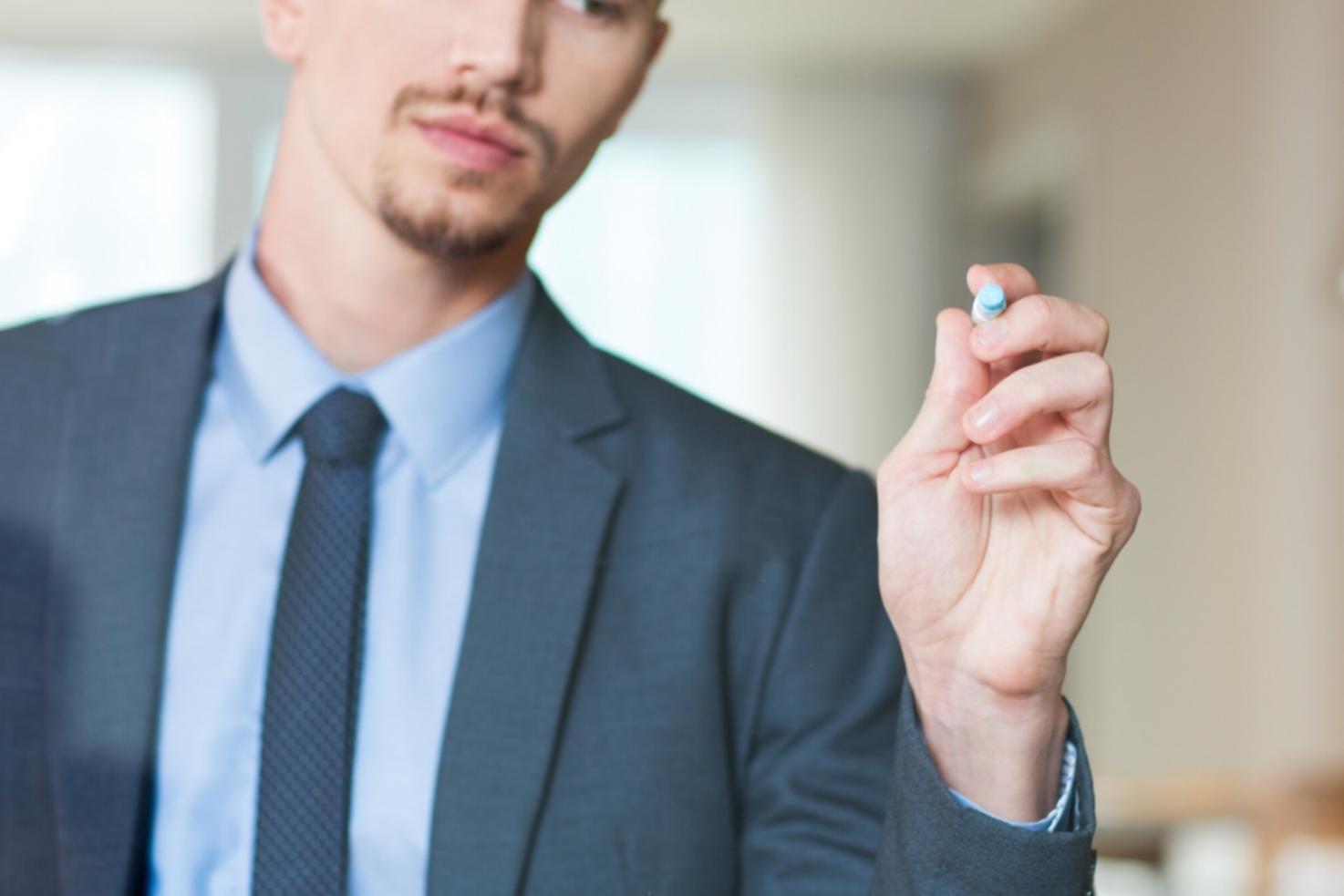 Professional financial analysis workspace showing charts and market data on multiple screens