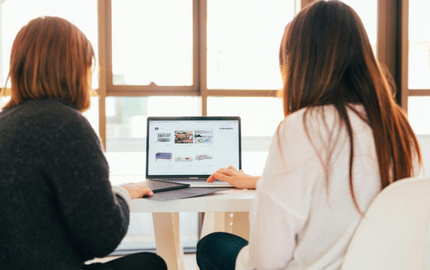 Modern financial analysis office with multiple monitors displaying market trends and data visualizations